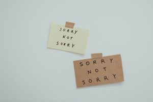 Image of stickers posted on wall, "sorry not sorry." Expressing if you want to change in your relationship or marriage?