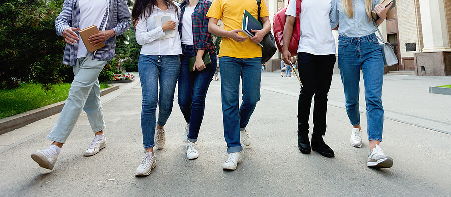 Group of students walking together, representative of peer pressure faced by today's teens and adolescents. If your teen or adolescent is struggling with their mental health, help is here. Therapy for teenagers in Alabama can offerthe support and understanding your teen needs to process their emotions. 