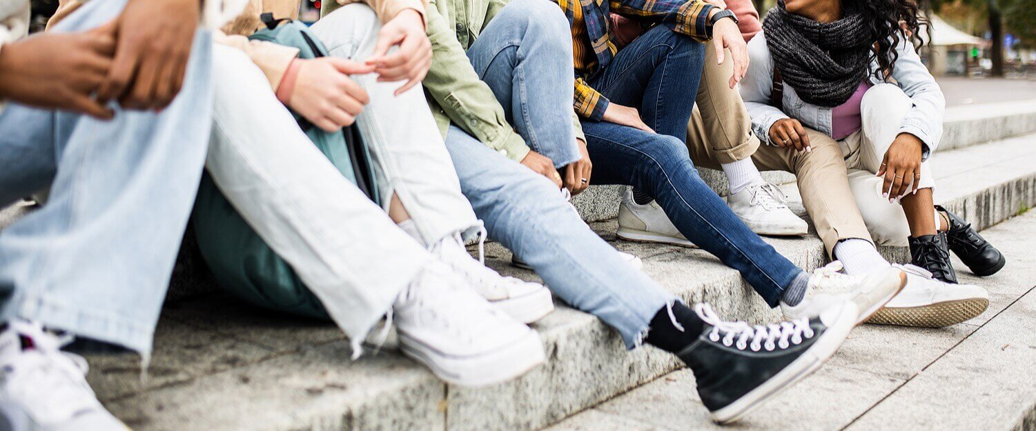 group of adolescents sitting on the stoop together. Being a teenager comes with a unique set of challenges and lots of peer pressure. Help your teenager learn the skills to stand strong and process their emotions effectively with therapy for teenagers in Alabama.