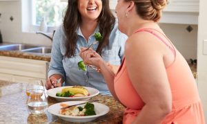Tw fiends maintaining a healthy relationship with food through eating disorder therapy. Recovery is possible, even if it seems daunting we are here to support you on your journey to healing with eating disorder therapy.