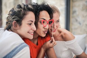 Three women smile for selfie. Learn how marriage counseling huntsville alabama can support can support codependency concerns. Speak with a black therapist huntsville, al and get therapy support