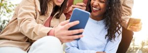 Friends smile around one another while taking pictures on their phone. This could represent the benefits of social media for teens. Learn how a counselor for teens in Huntsville, AL can offer support with addressing anxiety. Contact one to learn about therapy for teenagers in Huntsville, AL today.